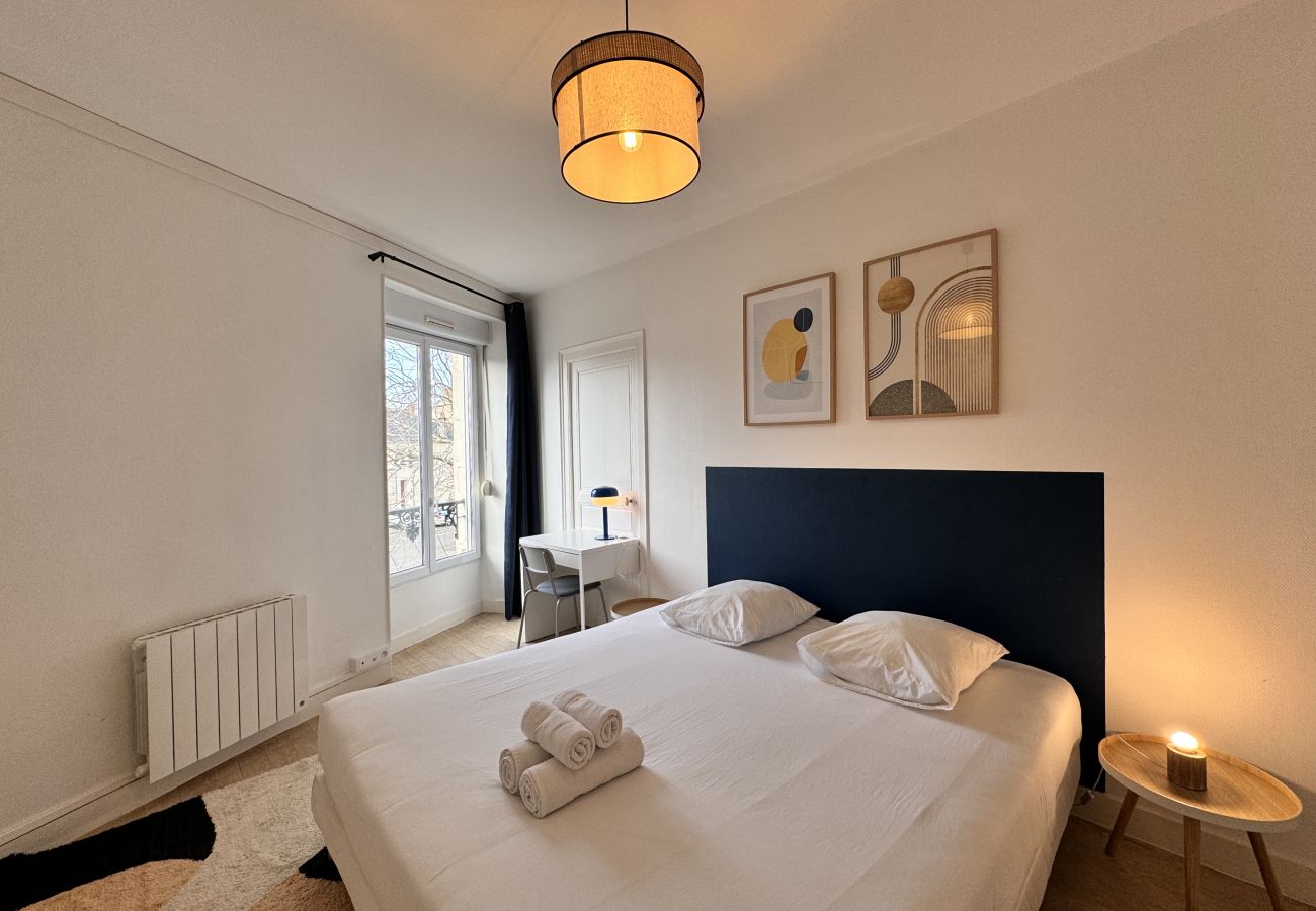 Bedroom with wardrobe and clothes hangers. 