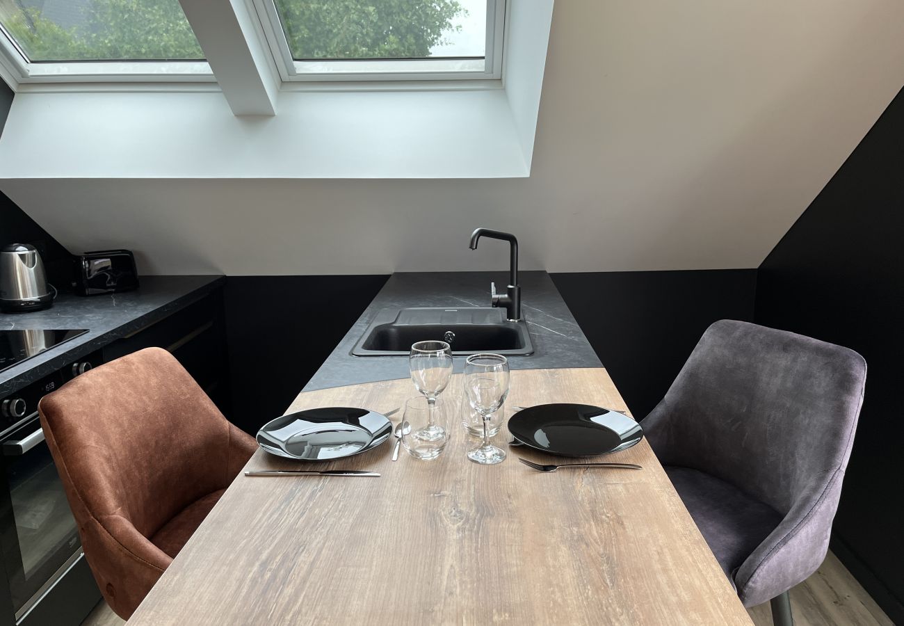 Open-plan kitchen with dining area. 